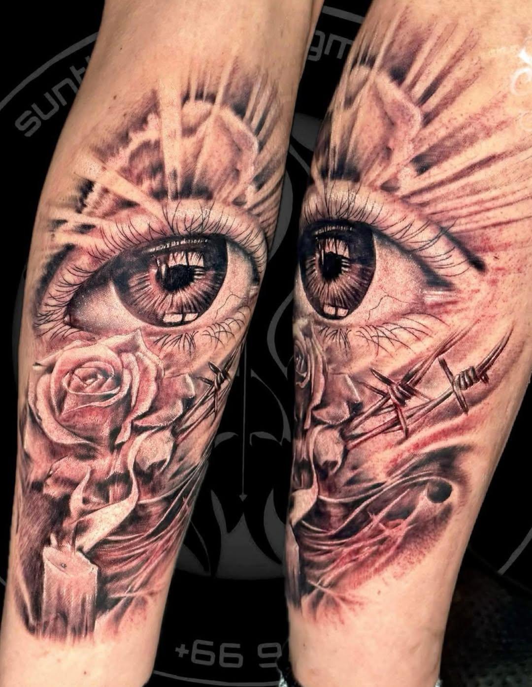 Realistic eye and rose black and grey forearm tattoo