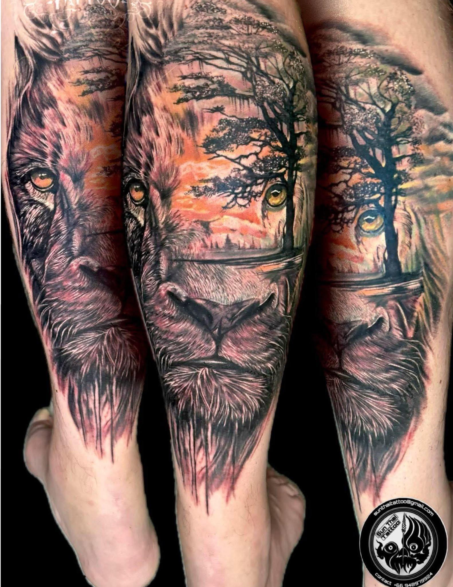 Realistic lion and savanna leg tattoo